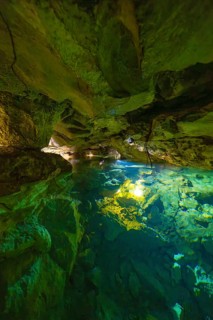 Scenario in a cave with crystal clear water and impressive rock walls, Wimsener Höhle, Hayingen,