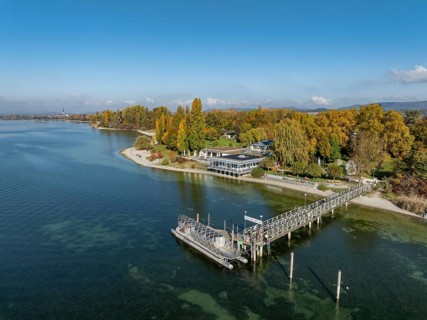 Aerial view of the Mettnau peninsula, surrounded by autumn vegetation, in western Lake Constance