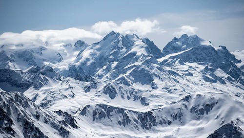 View of mountain panorama with mountain peaks of the Bernina Group, mountain landscape in winter,