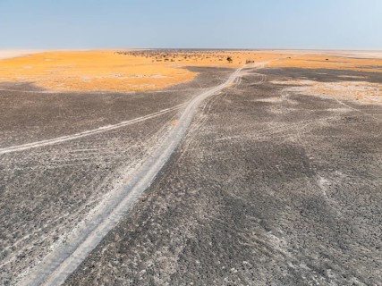 Aerial view, tire tracks on a salt pan, arid landscape, Botswana