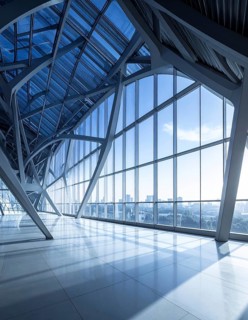 Modern architectural framework with glass and steel structure, glass facade with a greed of steel
