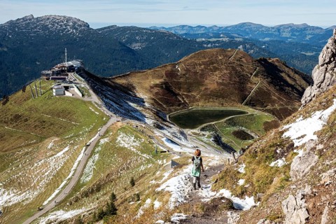 Female hiker on hiking trail below the Kanzelwand, back left Kanzelwandbahn mountain station,