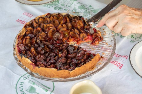 Fresh plum cake is cut, Bavaria, Germany