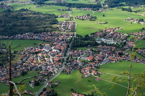 Deep view from Falkenstein of the alpine village of Inzell and the Inzeller moss, Bavaria, Germany