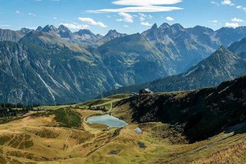 View from the Fellhorn Ridge hiking trail to Schlappoldsee and mountains of the Allgäu Alps,