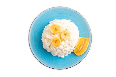White ?ottage cheese, Curd, with Banana isolated on white background, top view, flat lay, close up