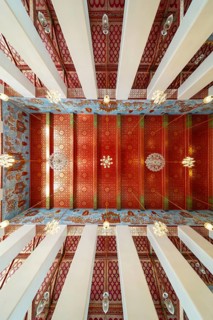 Photo from the frog persective:Ubosot (ordination hall) with columns (Sao) and richly decorated