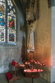 Sacrificial candles with Saint Mary, St. Martin Church, Amberg, Upper Palatinate, Bavaria, Germany