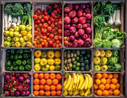 Fresh fruits and vegetables in a market display, aerial view perpendicular top down, healthy eating