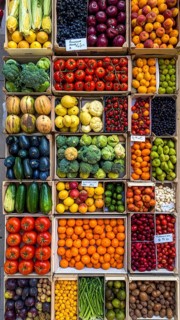 Fresh fruits and vegetables in a market display, aerial view perpendicular top down, healthy eating