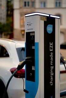 Parking lot with gas pump, EZE Network charging station, SICHARGE model for electric cars, charging
