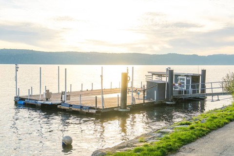 Quiet lakeside jetty in soft sunset light, Überlingen, Lake Constance, Germany