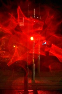Traffic light, road traffic at night and poor visibility in a city, autumn, Germany