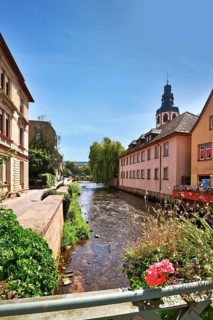 Ettlingen, Germany - August 13th 2025: View from bridge on Alb river in historic city center with