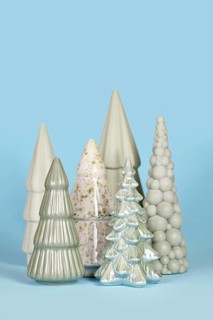 Beautiful different shaped light green ceramic Christmas trees on blue background