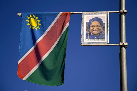 Namibian flag and image of President Dr. Netumbo Nandi-Ndaitwah, Windhoek, Khomas region, Namibia