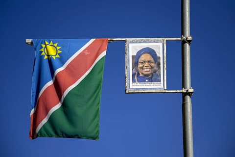 Namibian flag and image of President Dr. Netumbo Nandi-Ndaitwah on a street lamp, Windhoek, Khomas