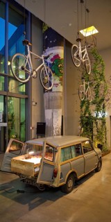 Entrance area to Monkey Bar with old Trabi in the evening, Charlottenburg, Berlin, Germany