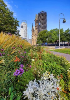 Planted middle strip of Tauentzienstraße with Kaiser Wilhelm Memorial Church, promenade,