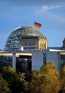 Reichstag dome with German flag, German Bundestag, government district, Berlin, Germany