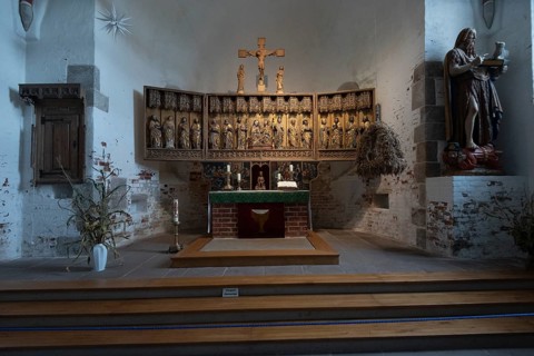 Carved altar in St John's Church, Nieblum, Föhr Island, Schleswig-Holstein, Germany