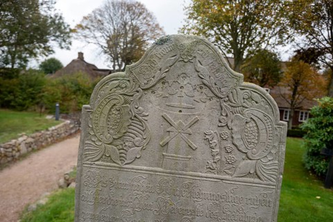 Close-up of a baroque gravestone in the cemetery of St John's Church, Nieblum, Föhr Island,
