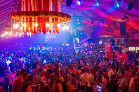 Cheerful celebration with light effects and live music, the crowd enjoys the festive atmosphere of