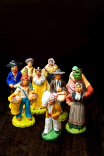 Colorful Provençal terracotta figurines represent traditional characters from rural life. Each