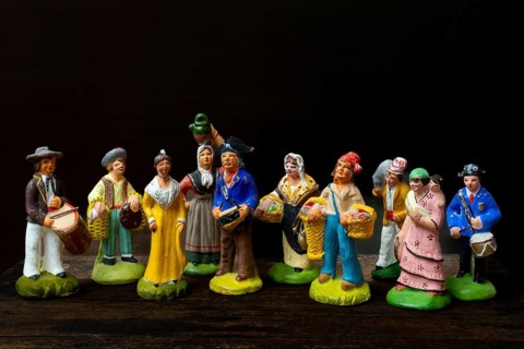Colorful Provençal terracotta figurines represent traditional characters from rural life. Each