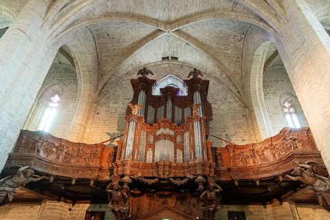 Organ loft of Saint Robert abbey. La Chaise Dieu. Haute Loire department. Auvergne-Rhone-Alpes,