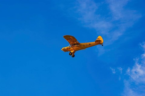 A Piper PA-18 Super Cub of the Bravo Lima Formation during a flight demonstration as part of an air