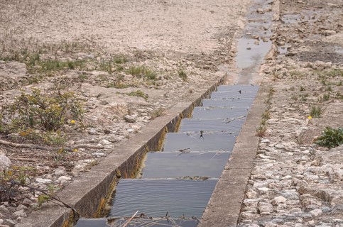 Fish ladder at a waterless body of water, an emptied reservoir, the Metzingen-Glems reservoir,