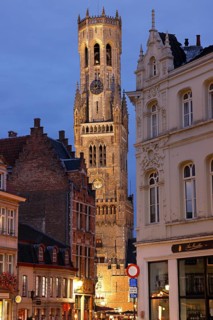 Illuminated Belfry in the historic city centre of Bruges in the evening light, Belfort on the Grote