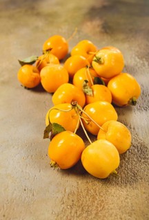 Yellow small apples, Chinese variety, scattered on the table, top view, no people