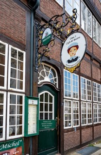 Nose sign and entrance to Oma's Cafe and Bistro in the Krameramtsstuben, historic building,