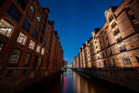 Illuminated warehouses in Hamburg's Speicherstadt, blue hour, Hamburg, Germany