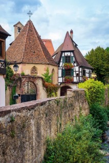 Picturesque Kaysersberg with half-timbered houses on the Weiss river in the old town centre