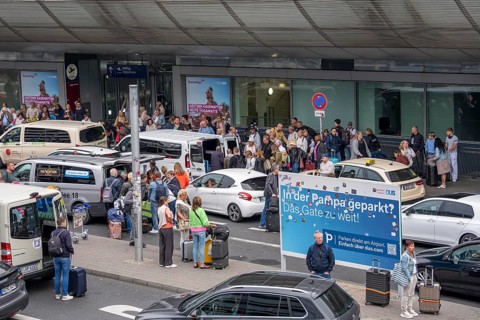 Ahead of Terminal B, many thousands of people set off on holiday on the first day of the North