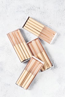 Cigarette casings, packed in boxes, on the table, top view