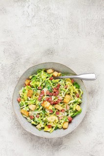 Brussels sprouts Caesar salad, with bacon and croutons, healthy food, homemade, no people