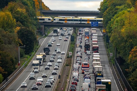 Local train crossing the A3 motorway between the Hilden junction and the Mettmann junction, view to