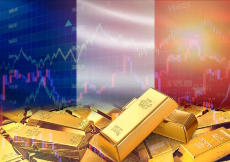 Gold bars on France flag in background. Gold bars stacked on French flag. Concept of France gold