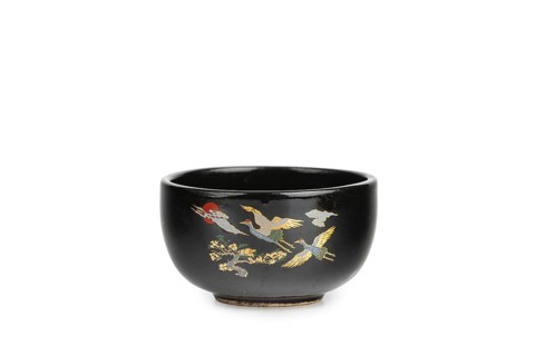 Black bowl with golden cranes, Asian decor, white background