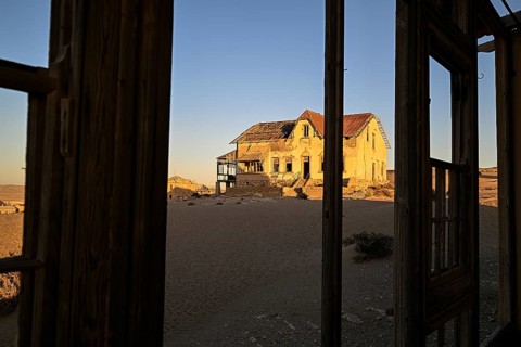 View from a former dwelling house into the desert, Kolmanskop, restricted diamond area, Karas
