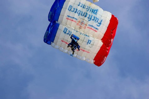 Two parachutists during an aerial acrobatic performance as part of an air show at the Rossfeld in