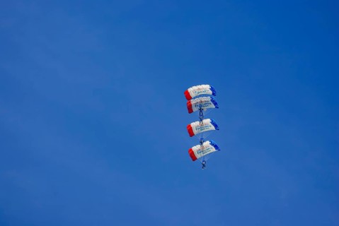 Parachutists during an aerial acrobatic demonstration as part of an air show on the Rossfeld in
