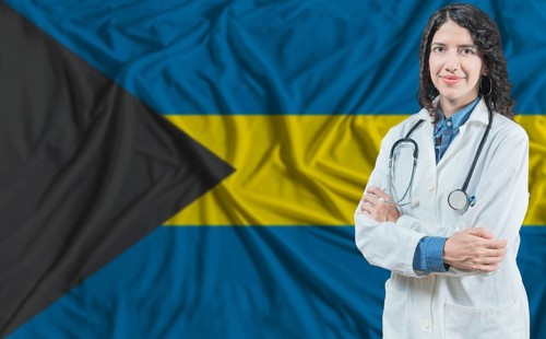 Bahamian medicine and healthcare concept. Doctor close up against Bahamas flag background