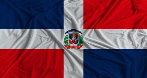 Dominican Republic flag with fabric texture background. National flag of Dominican Republic