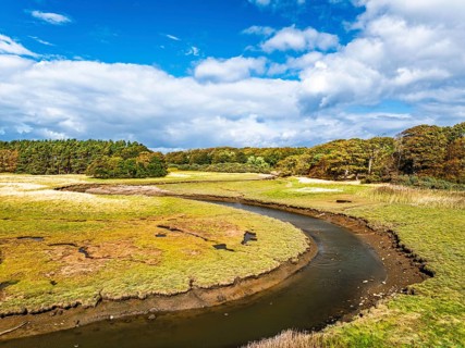 Marshes over Aberlady Bay and Peffer Burn from a drone, Luffness Castle, Aberlady, East Lothian,