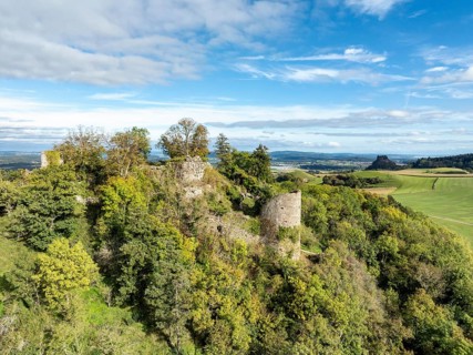 Aerial view of the Hegau volcano and the Mägdeberg castle ruins, with the Hohenkrähen on the